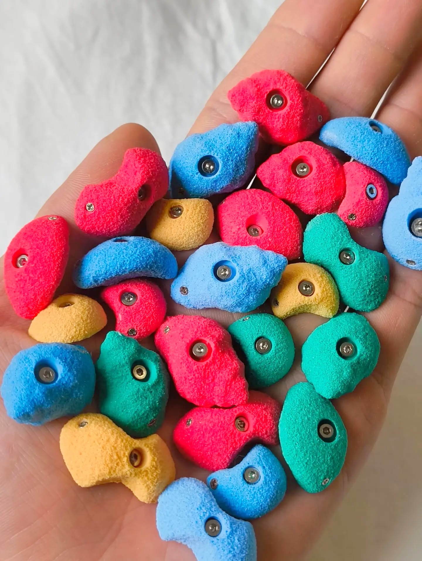 Handful of colourful miniature climbing holds
